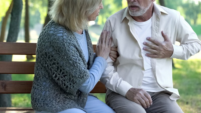 Senior man having heart attack during walk with wife, cardio problems healthcare